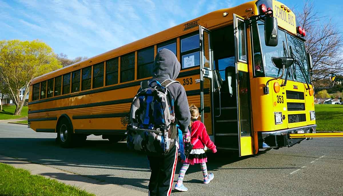 Children Getting on School Bus