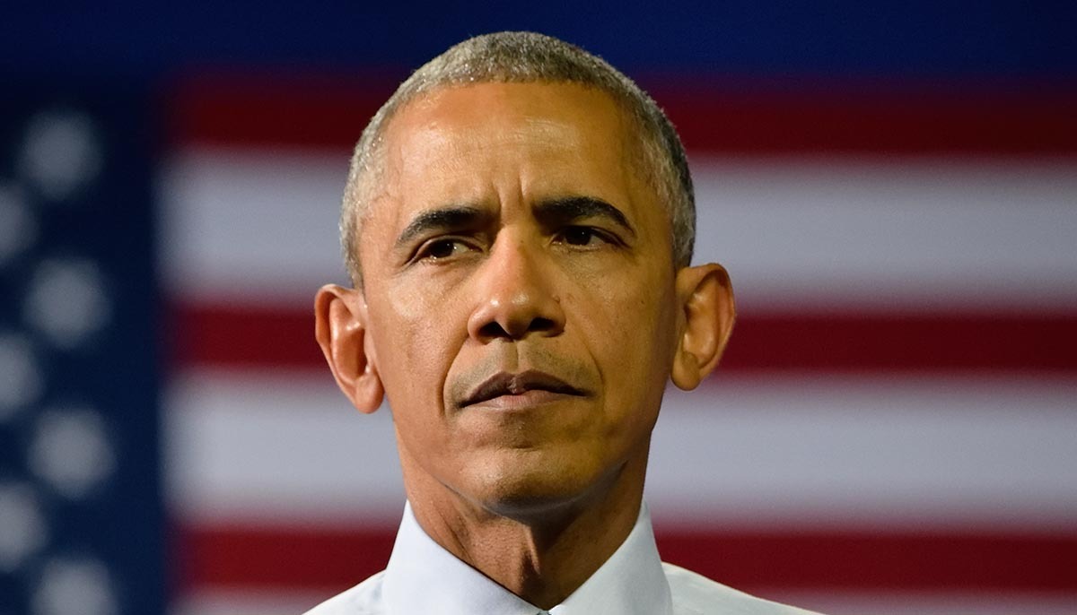 Barack Obama stands with a concerned face at the Charlotte Convention Center