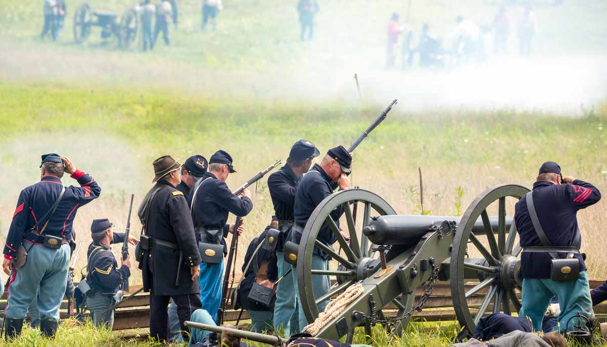 Civil War reenactors on a mock battlefield