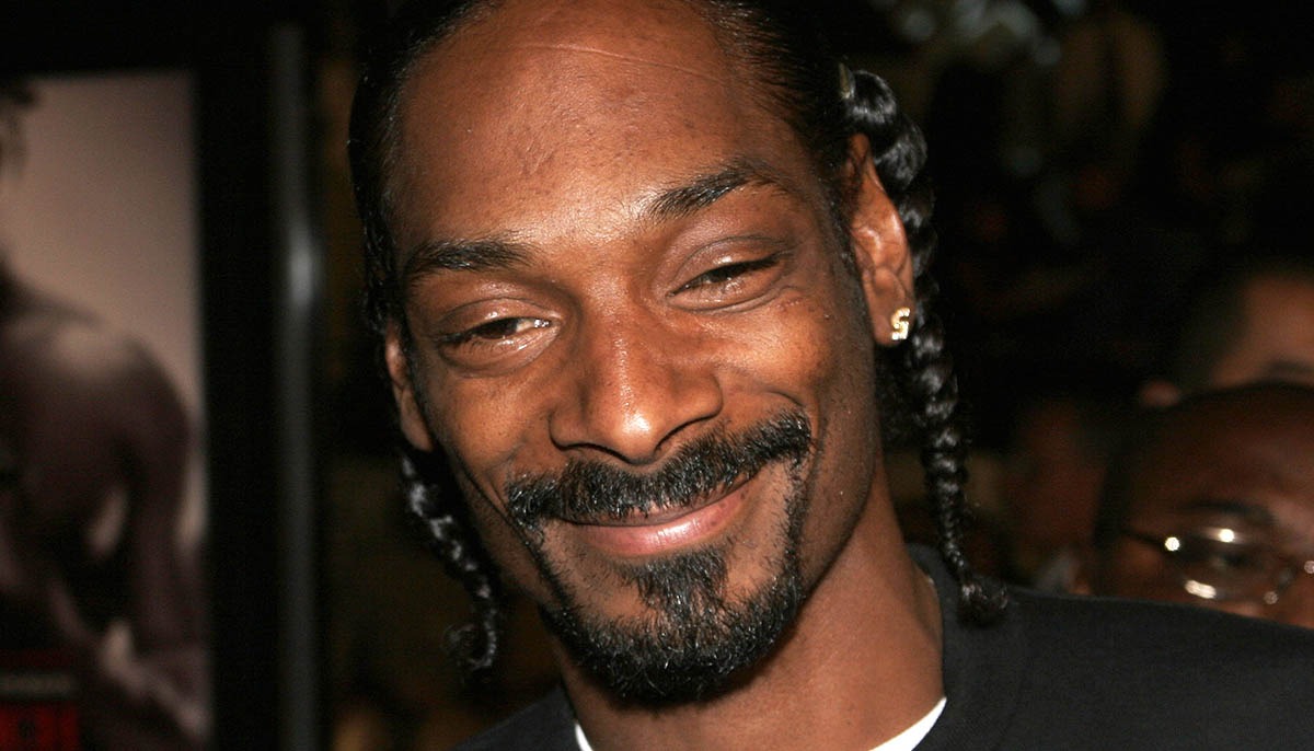 Snoop Dogg smiles at the camera during a Los Angeles Premiere