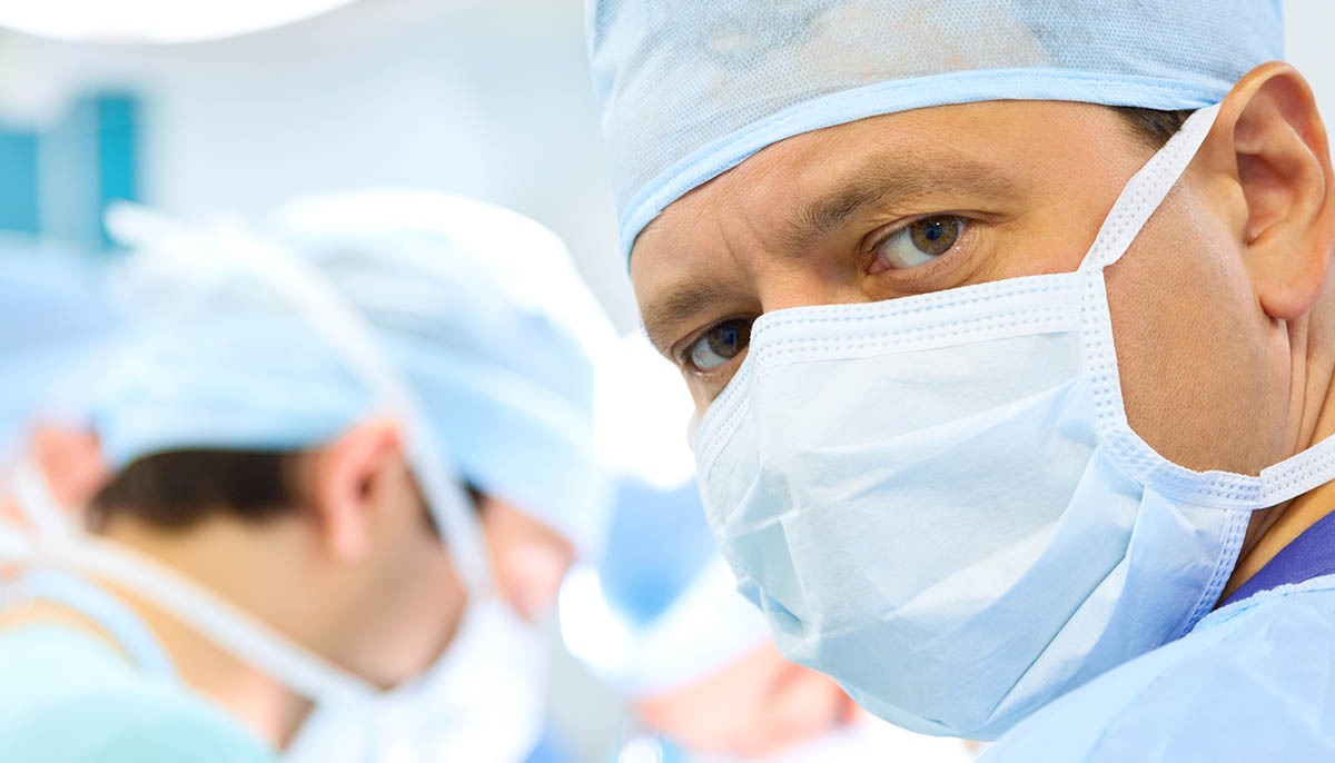 A surgeon looks attentively while in operating room