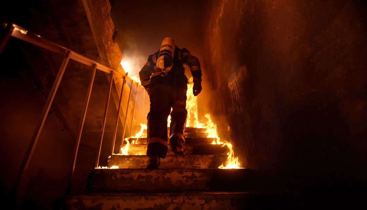 Firefigher Rushes into Burning Building