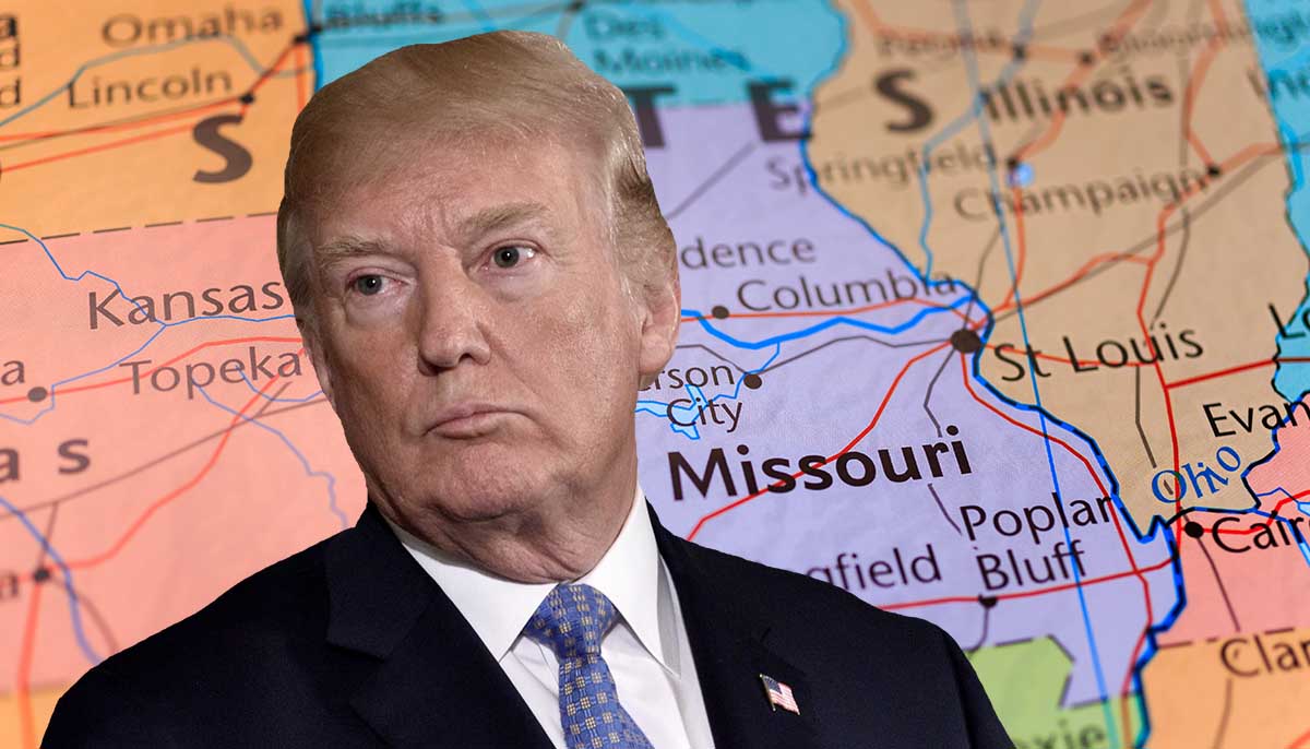 Trump stands with map of Missouri in the background