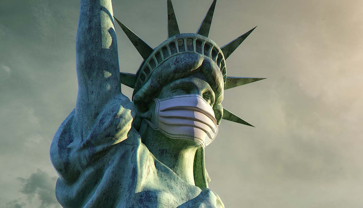 the statue of liberty is shown wearing a coronavirus mask