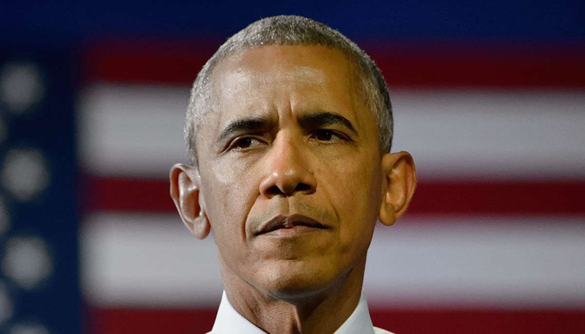 Former President Barack Obama with a concerned look on his face