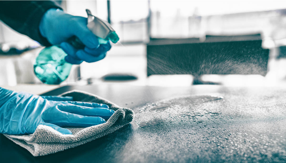 Disinfectant being used on a home table