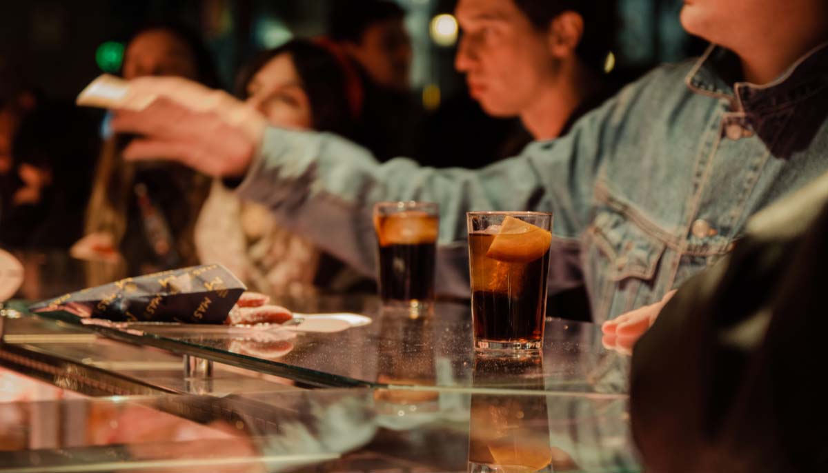 Patrons in a crowded bar