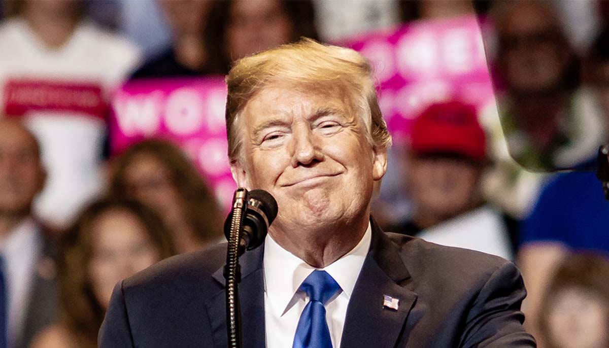 Trump smiles during a rally