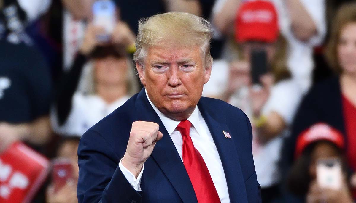 Donald Trump gestures with a confident fist pump