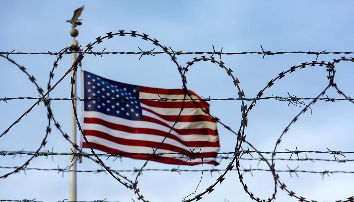 an american flag with barbed wire