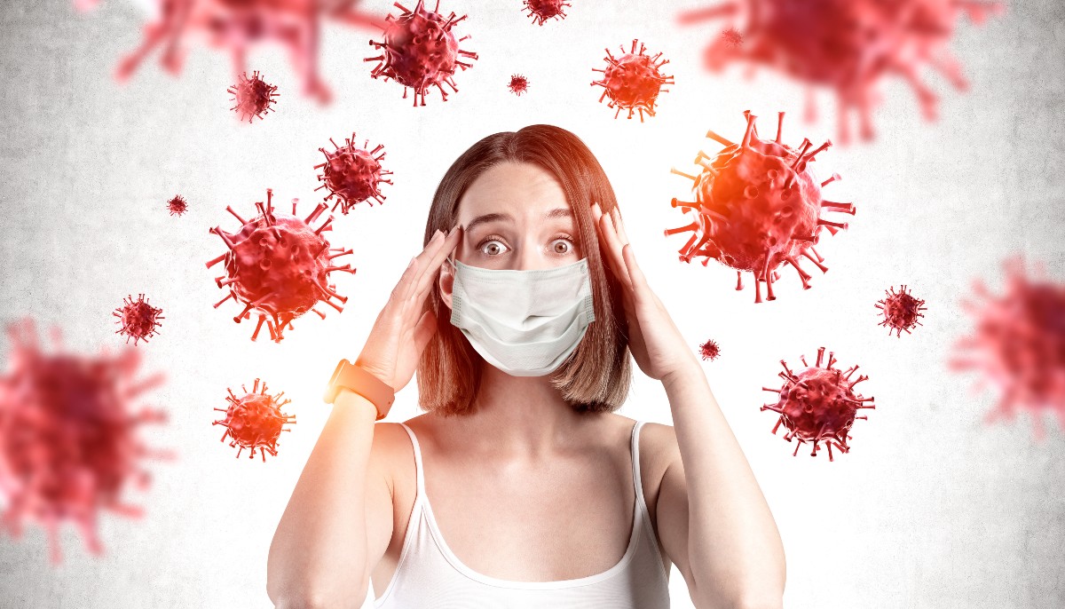 a woman looking stress surrounded by coronavirus